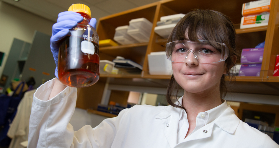 Lynne Hagelthorn holds a vial