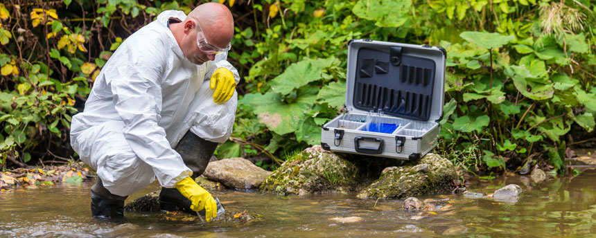 scientist looking at creek