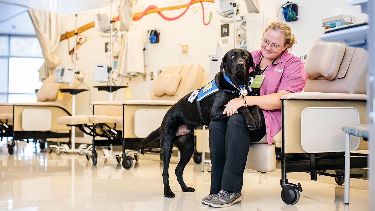 Huggie, with foster mom Jennifer Belke