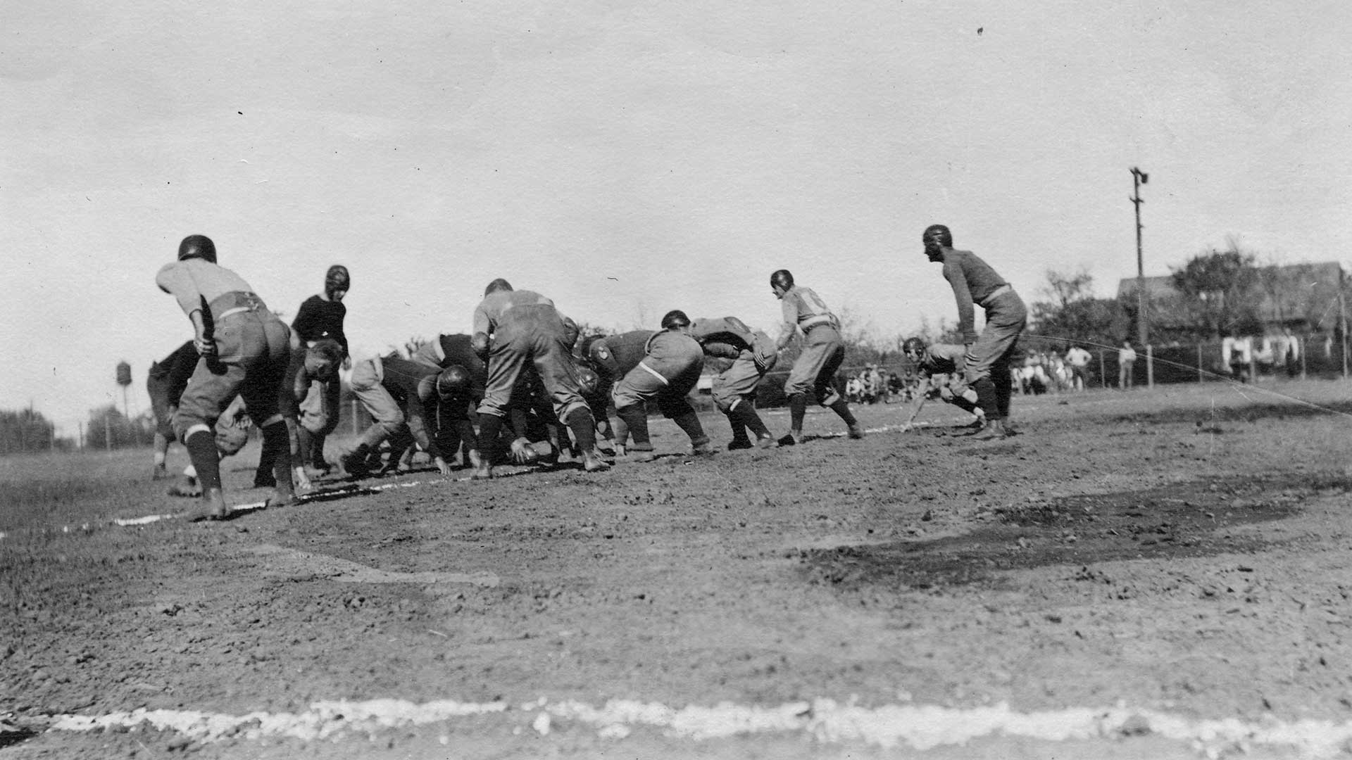 UC Davis football team on a dirt field, circa 1928