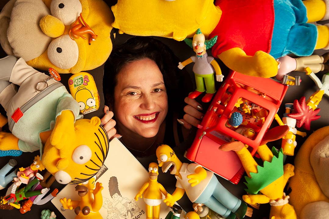 UC Davis Professor Karma Waltonen poses with Simpsons memorabilia