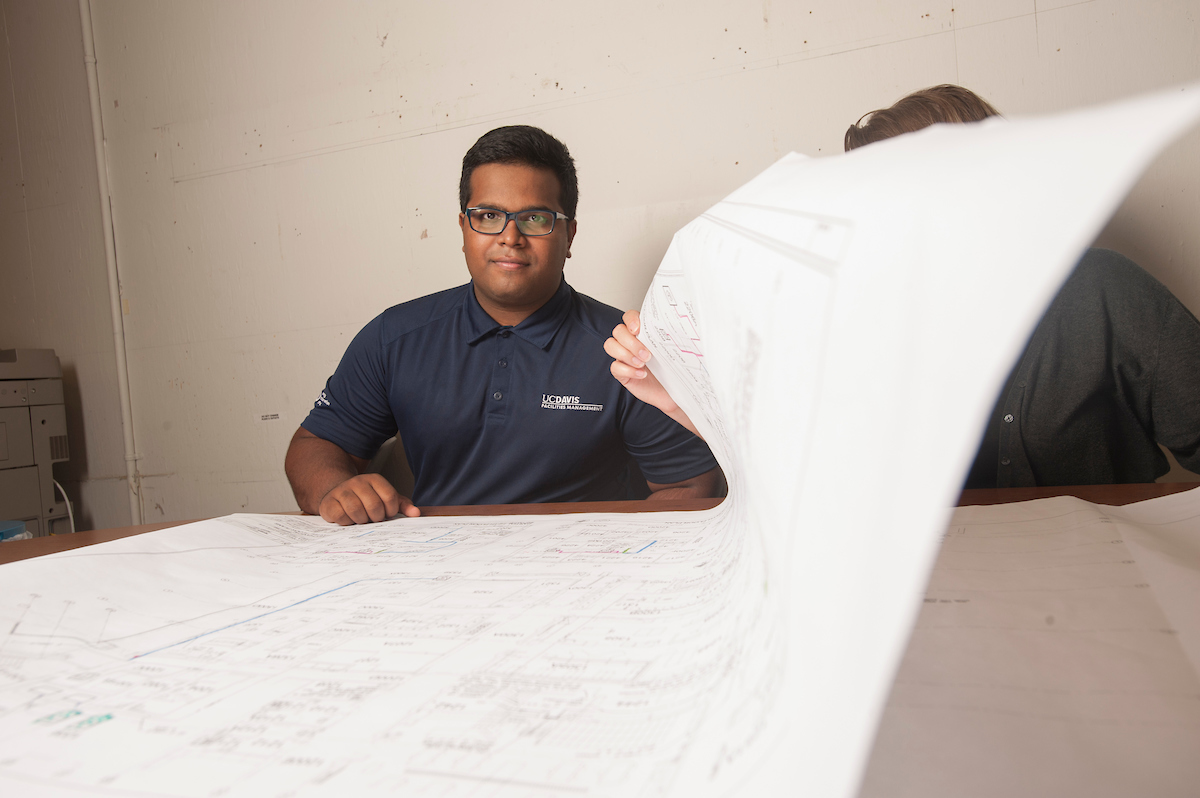 A student looks at a large planning draft at UC Davis.