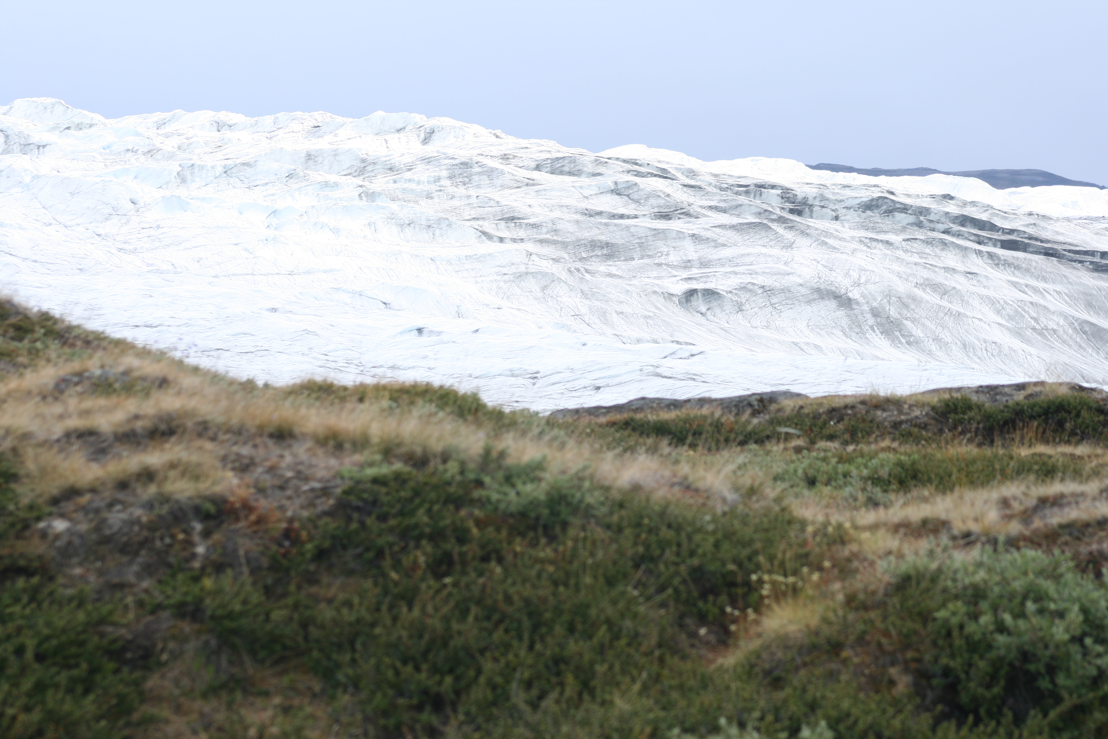 Greenland landscape of Arctic tundra meeting snow and ice 