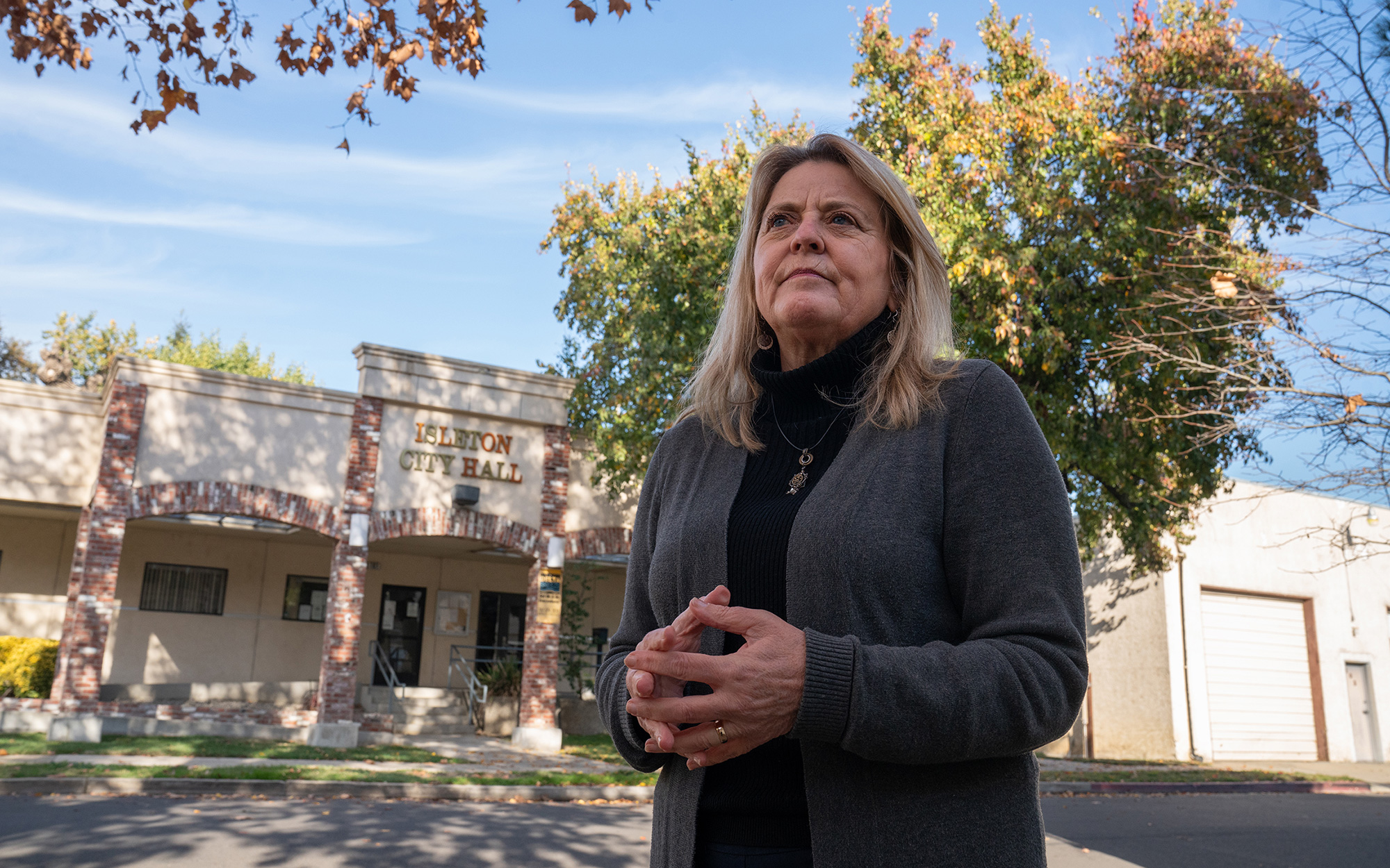 Woman stands in front of Isleton City Hall