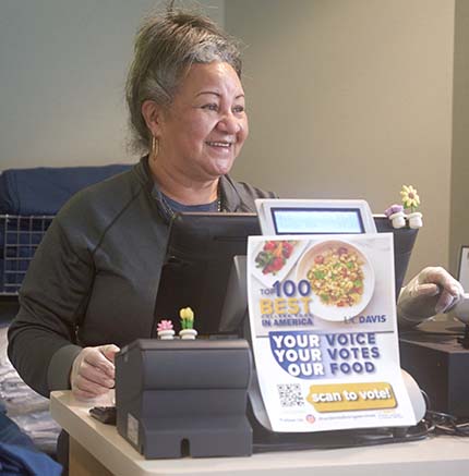 Cecelia Maikai-Beard working at dining commons cash register