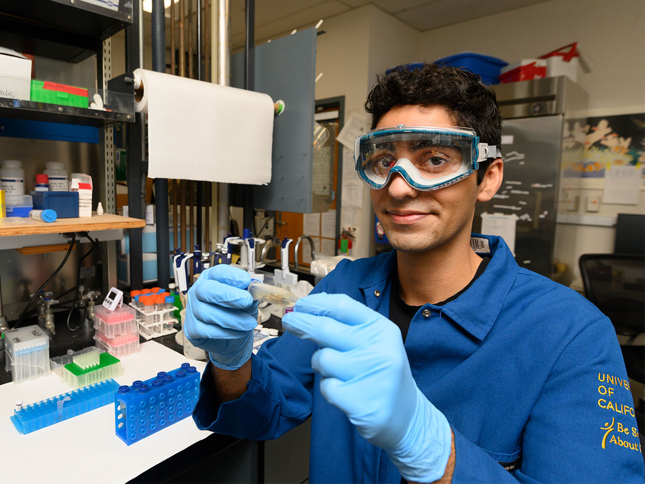 Animal science major Shayan Kaveh is engaged in lab work, showcasing his skills during an internship at UC Davis.