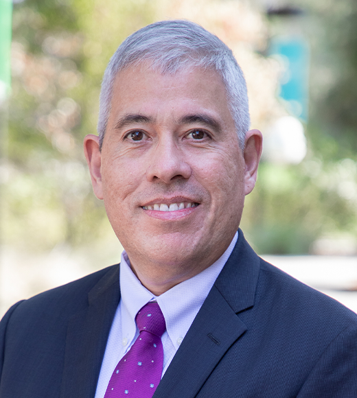 Man with gray hair in blue suit, portrait