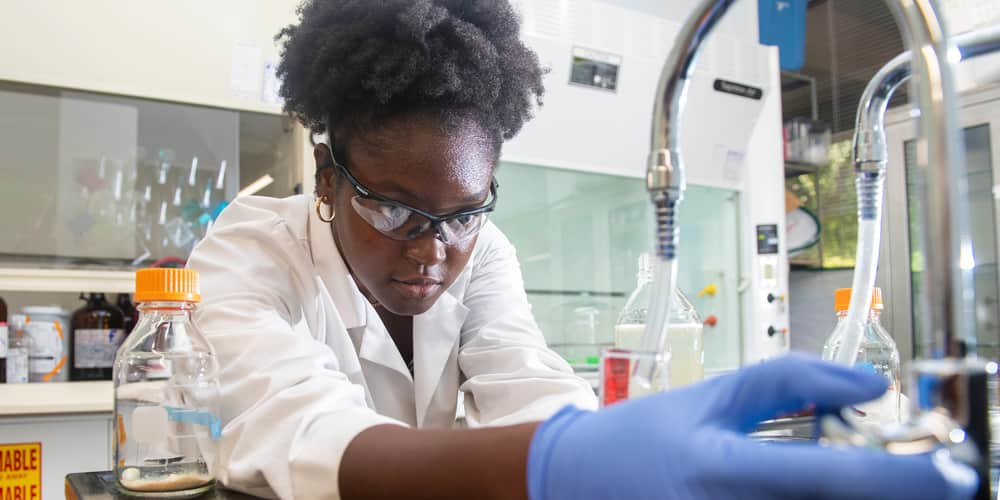 a student working with chemicals in a laboratory