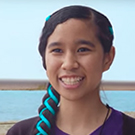 female student against water background