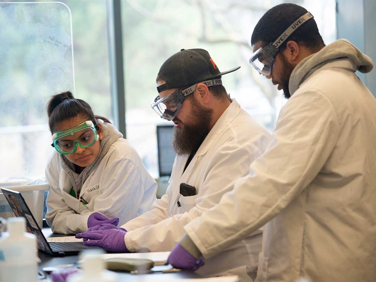 (l to r) Natalie Garcia, Josh Hagen and Oliver Davis, Food Science majors, work on the lab results during the Food Analysis Lab.