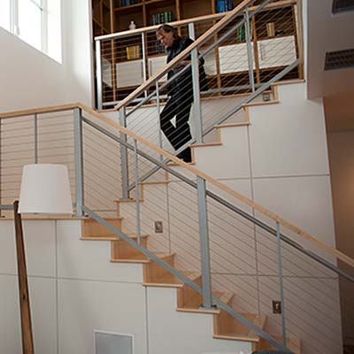 Man walking down stairs in a new home