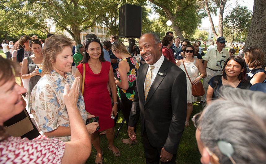 Gary May greets staff and faculty at an ice cream social.