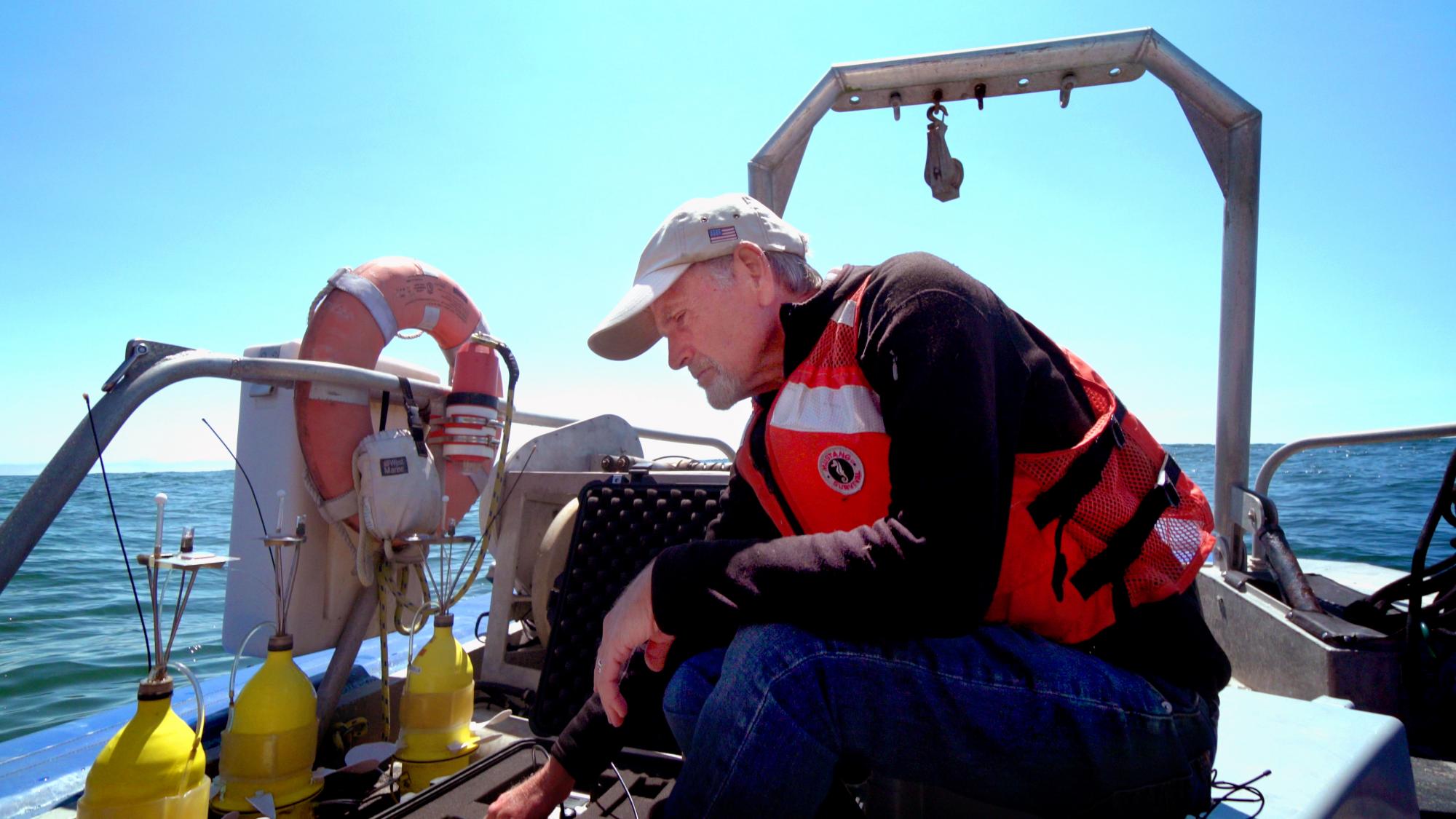 Male scientist on boat