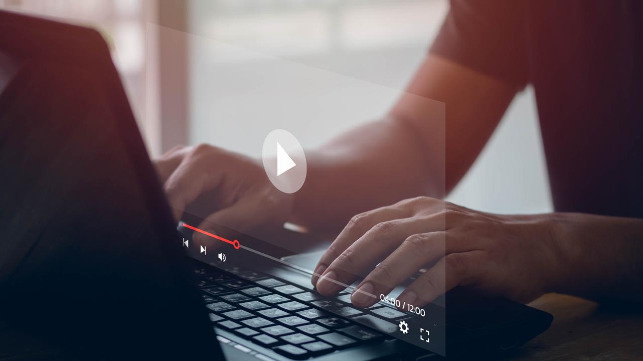 Person with hands on computer