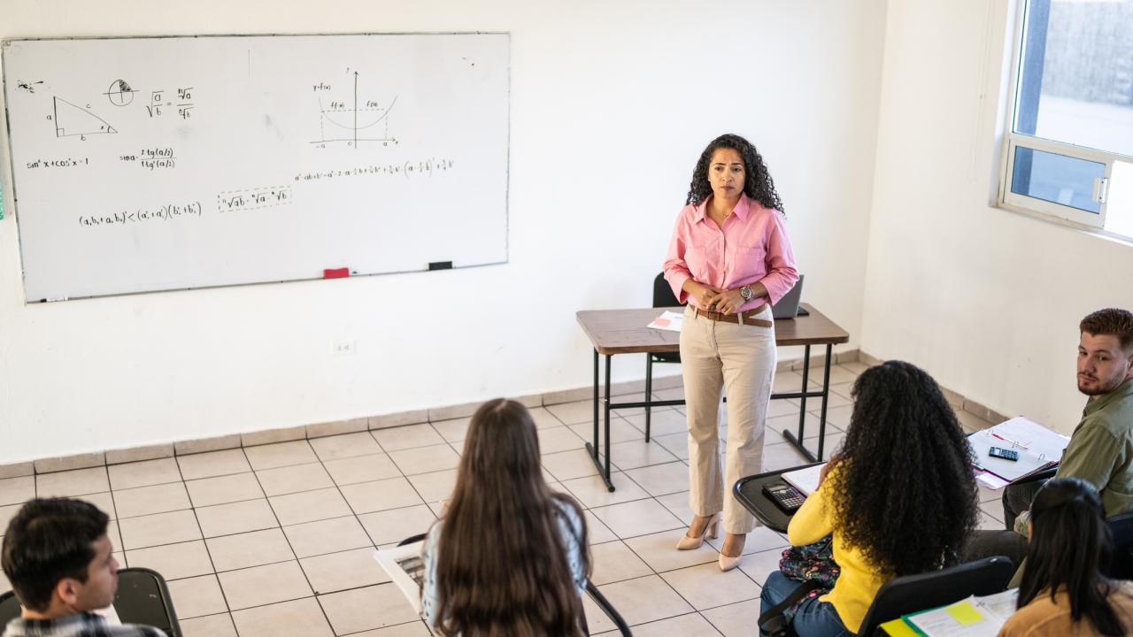 Teacher and students in classroom.