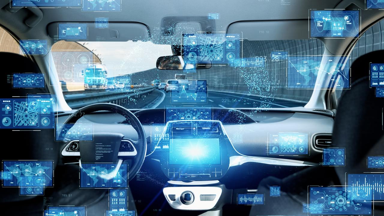 Futuristic rendering of car windshield and dash with floating blue displays