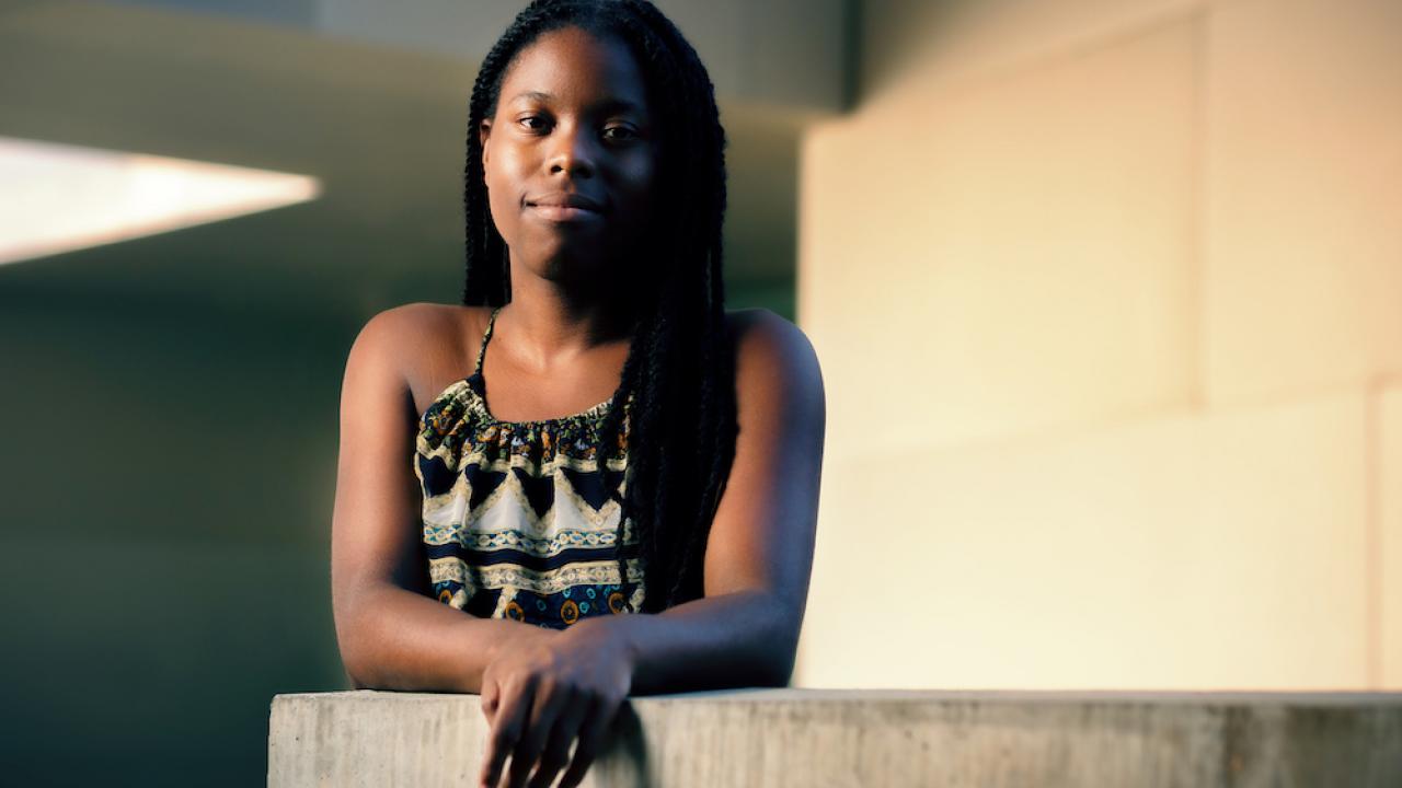 Tiana Williams leans on a concrete divider at UC Davis.