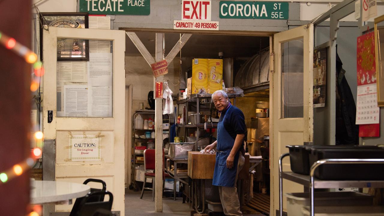 Man stands in the back of a historic restaurant