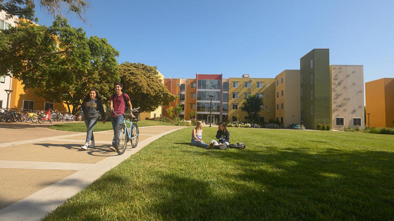 students walk through tercero quad on campus