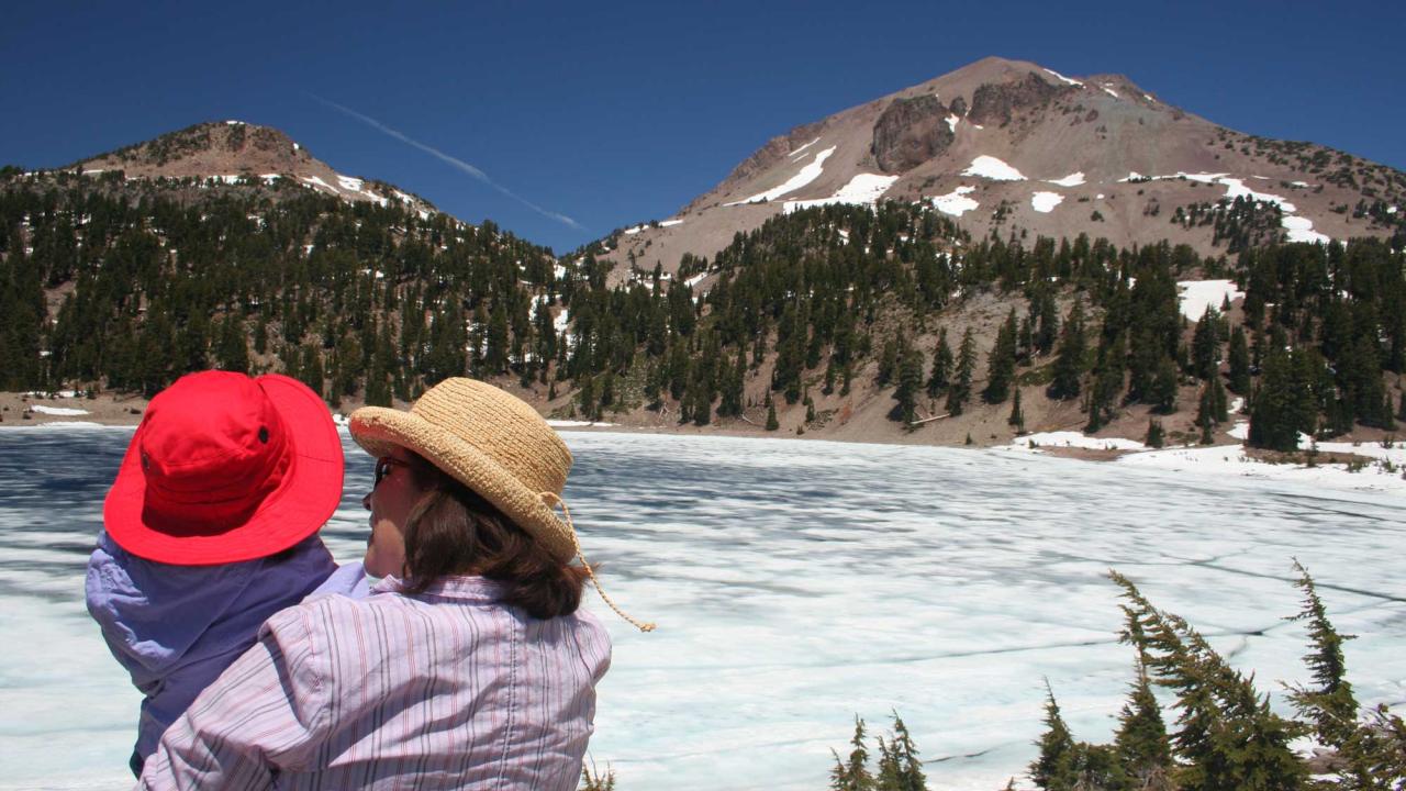 Woman and baby looking at mountain vista