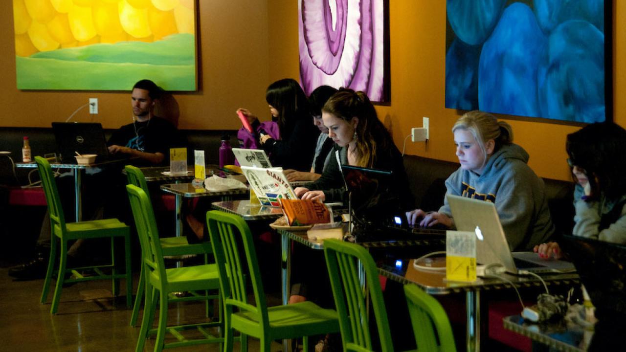 Students study while grabbing a bite to eat