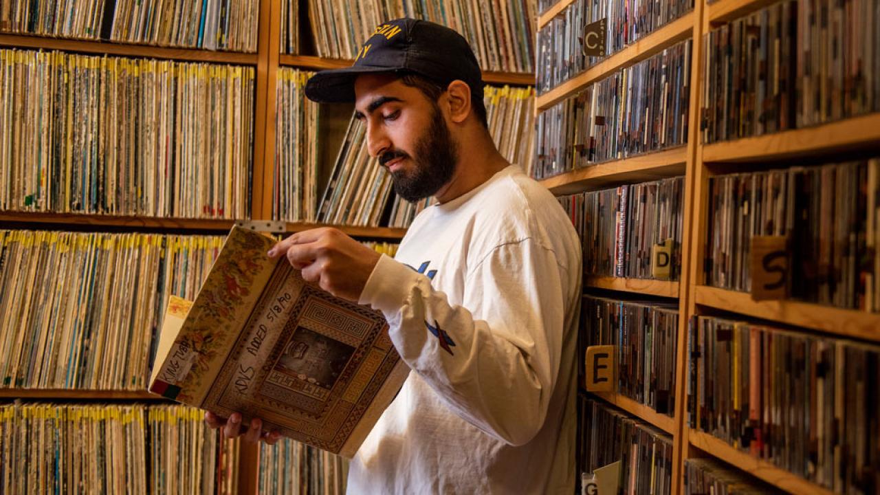 A student browses the vinyl records at KDVS the student run radio station