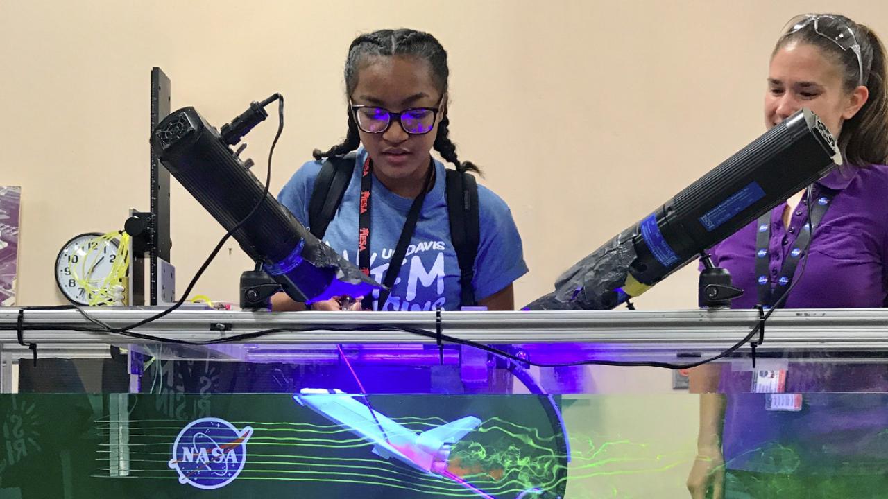 two students exploring engineering at a science museum