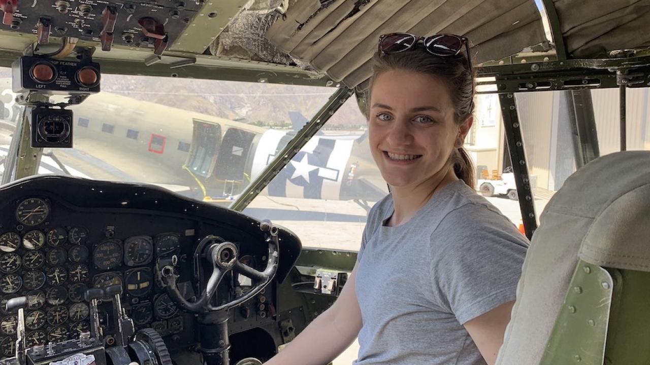 Bethany Baldwin-Pulcini sits in the cockpit of a rocket. 