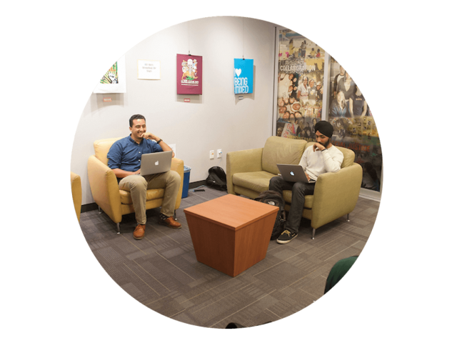 Two male students enjoy a conversation with each other at the UC Davis Student Community Center