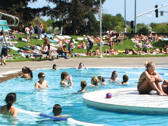 Students sunning themselves at the UC Davis rec pool