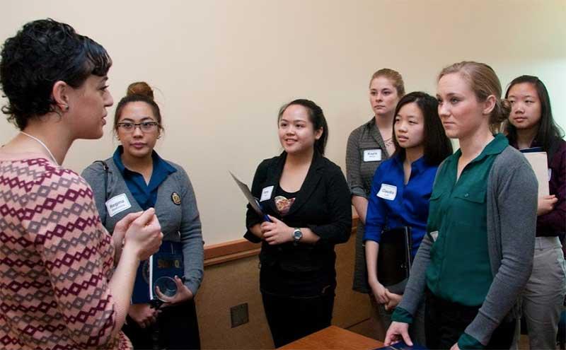 woman talking to female students