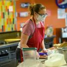 Staff member cooking at CoHo.