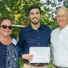 Laurie Vazquez, son Eliseo Vazquez and Ken Burtis, certificate presentation