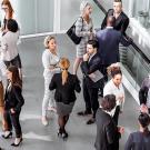 Stock photo of people standing around. 