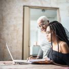 Student working with adult