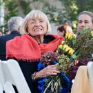 Photo: Margrit Mondavi holding bouquet of flowers