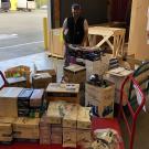 Man standing with donated supplies.