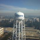 Smoke over the campus, main "UC Davis" water tower in foreground.