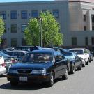 Cars parked in aisle, on top floor of the Quad Parking Structure