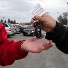 A driver hands off keys to an attendant.