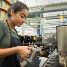 Photo: Plant sciences major Yasmeen Haider prepares a coffee drink at the Coffee House.