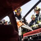 Student firefighters use the Jaws of Life.