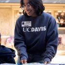 Lizette Luis works with kids at North Davis Elementary School