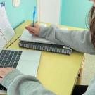 Aleshia Rose at her desk