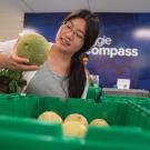 Kathleen Luo picks out produce