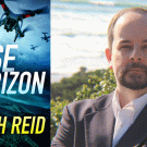 Joseph Reid pictured with the book cover for False Horizon