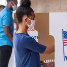 Voters voting in outdoor booths