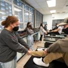 Two students look at how the ankle muscles work in a class exercise.