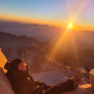 Grace Cureton poses with the Mount Whitney sunrise