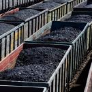 train carrying open-air coal